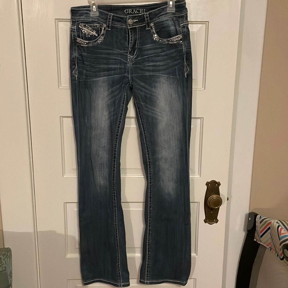 Grace in LA size 28. Bootcut with no wear on hem at all. Embellished pockets